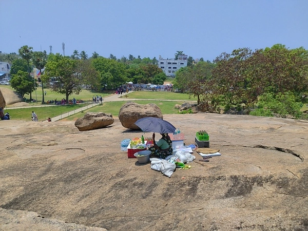 Women selling snacks behind butter ball